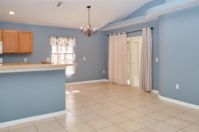 2726 Randal Way, Kissimmee, FL 34743 - kitchen with vaulted ceiling, light tile patterned floors, a chandelier, recessed lighting, and light countertops
