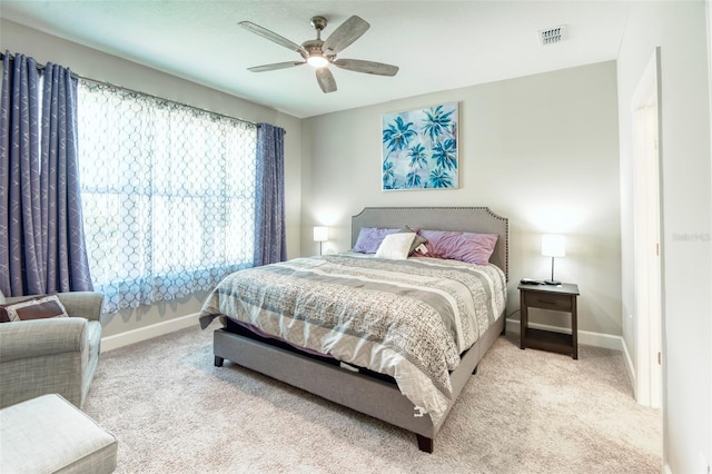 bedroom with light colored carpet and ceiling fan