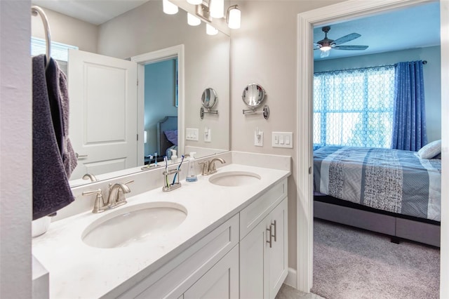 bathroom with dual bowl vanity and ceiling fan