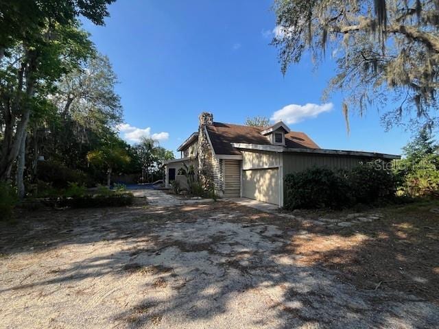 view of side of property with a garage