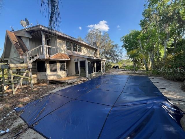 view of swimming pool featuring a deck