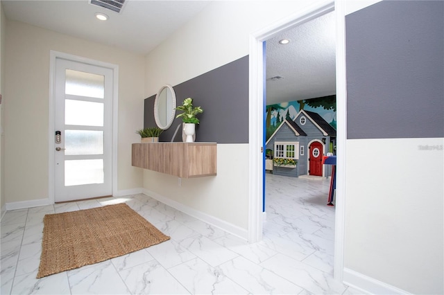 entrance foyer featuring light tile flooring