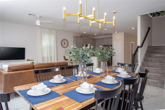 dining area featuring ceiling fan and light tile flooring