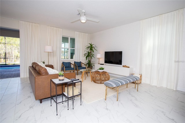 living room with light tile flooring and ceiling fan