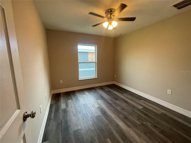 unfurnished room with dark hardwood / wood-style floors and ceiling fan