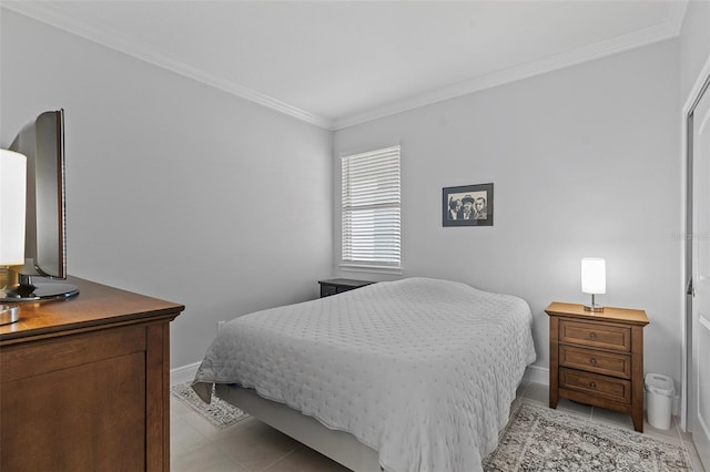 tiled bedroom featuring ornamental molding