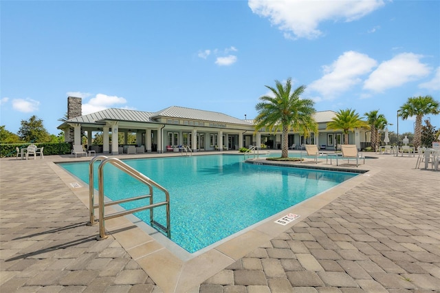 view of swimming pool with a patio