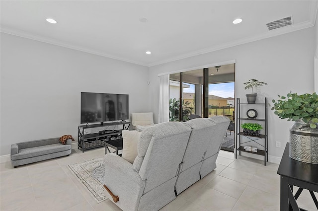 living room featuring crown molding and light tile floors