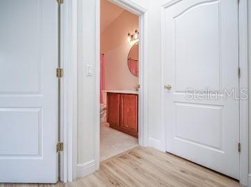 corridor featuring light hardwood / wood-style flooring