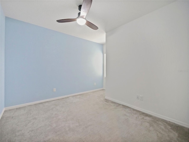 unfurnished room with carpet and ceiling fan