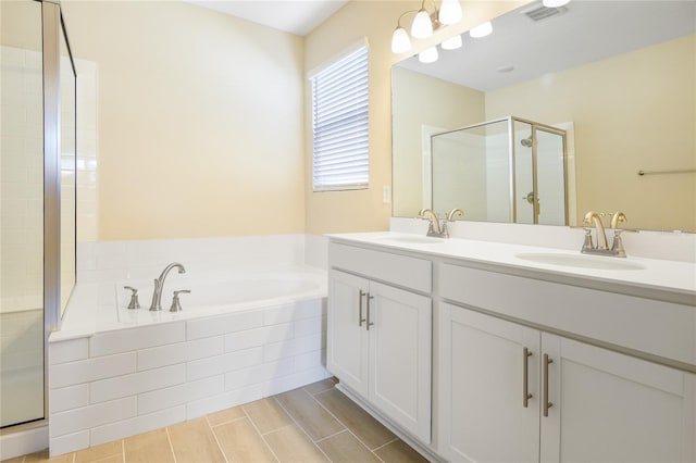 bathroom featuring vanity and plus walk in shower