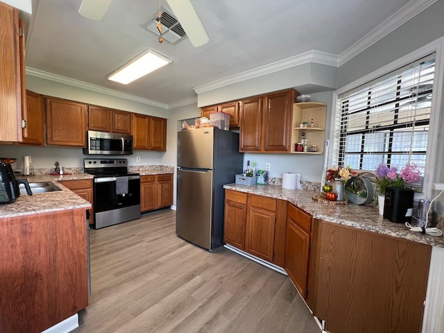 kitchen with sink, light wood-type flooring, crown molding, ceiling fan, and stainless steel appliances