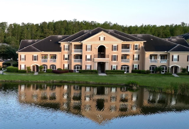 14205 Falls Church Dr Unit 2002, Orlando, FL 32837 - back of property featuring a yard, a water view, and a balcony