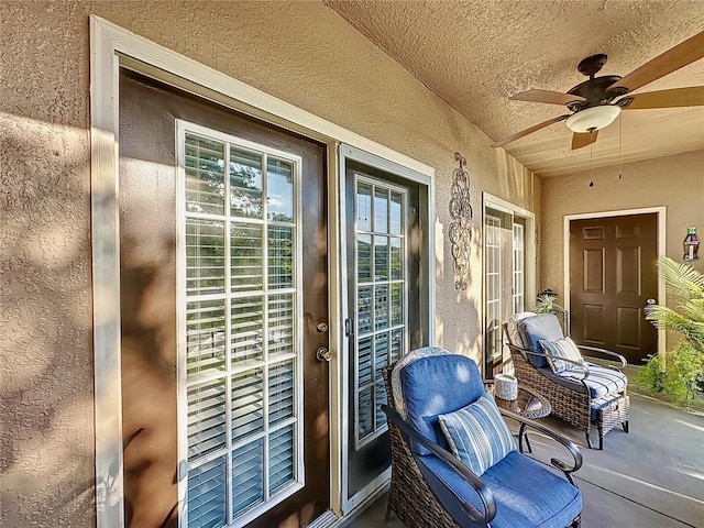 exterior space with ceiling fan