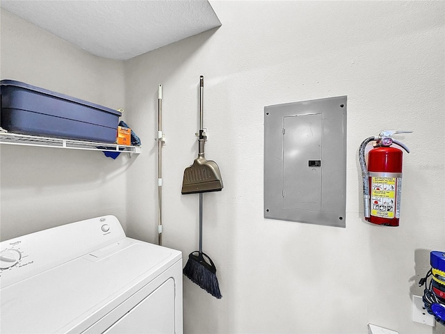 laundry area featuring a textured ceiling and washer / clothes dryer