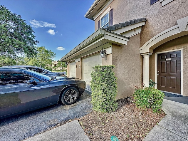 view of side of home featuring a garage