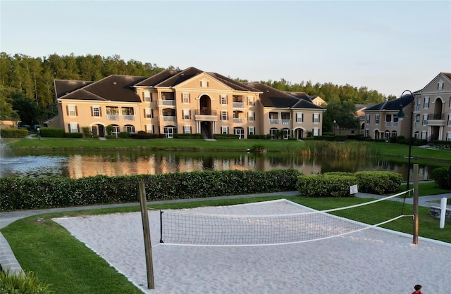 exterior space featuring a yard and a water view