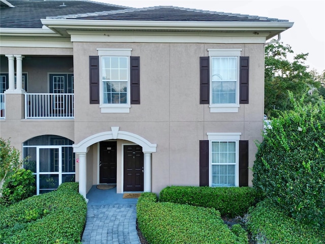 view of front of home with a balcony