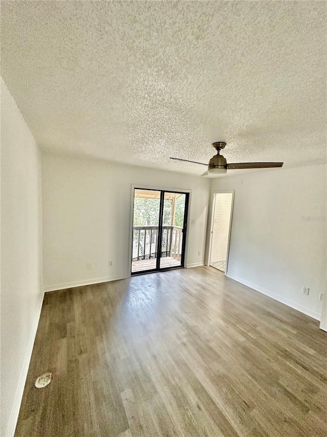 spare room featuring ceiling fan and a textured ceiling