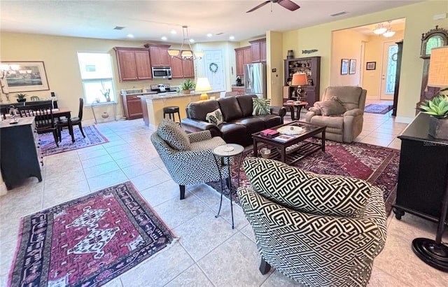 living room with ceiling fan and light tile floors