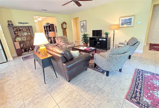 living room with ceiling fan and tile flooring