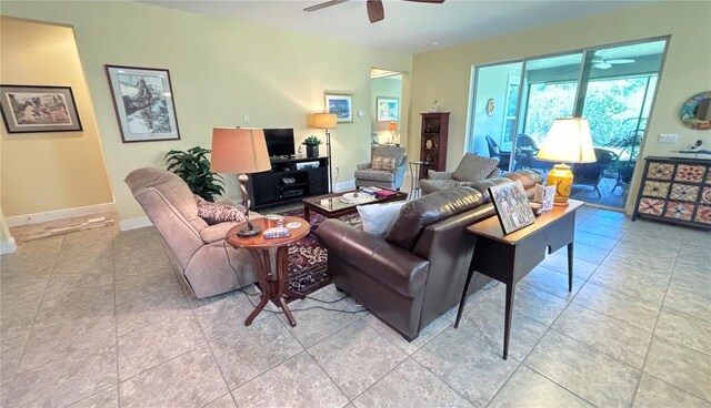 living room featuring ceiling fan and tile floors