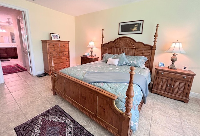 tiled bedroom featuring ensuite bathroom