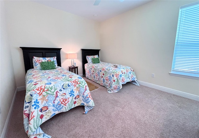 bedroom featuring ceiling fan and carpet floors