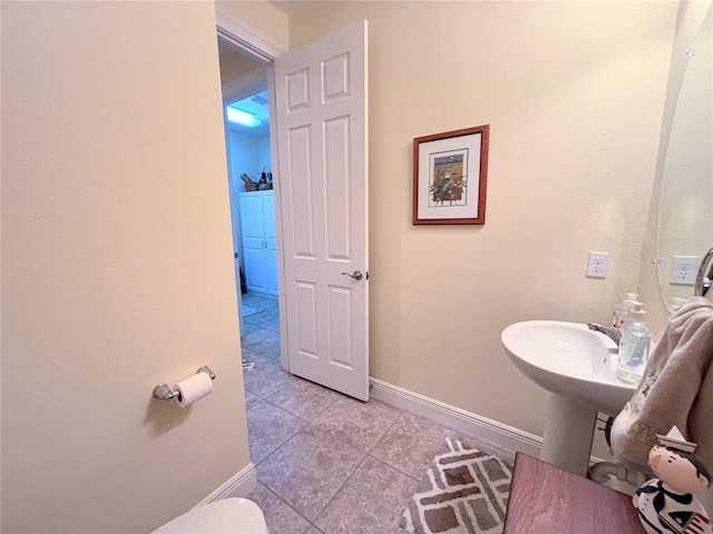 bathroom featuring tile floors