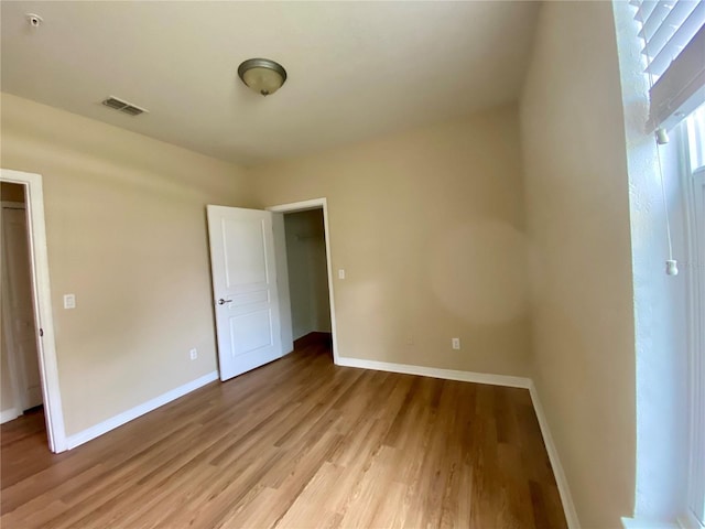 empty room with wood-type flooring