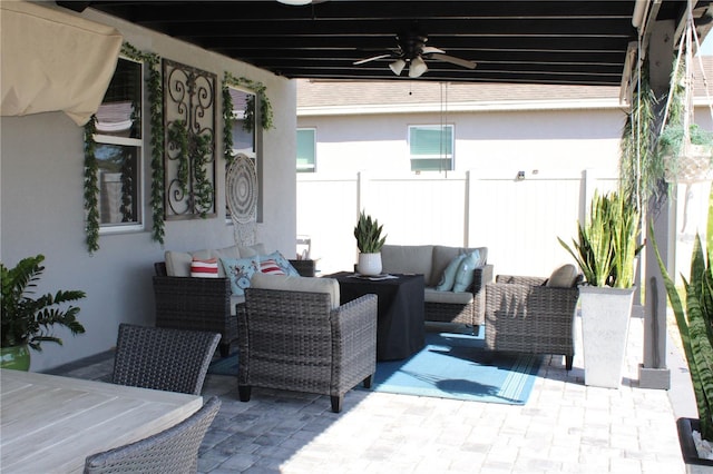 view of patio featuring outdoor lounge area and ceiling fan