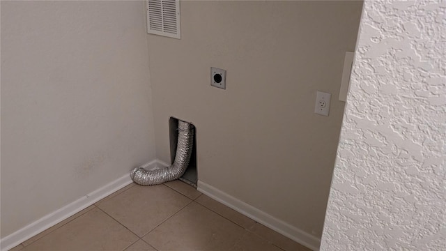 laundry room featuring tile floors and electric dryer hookup