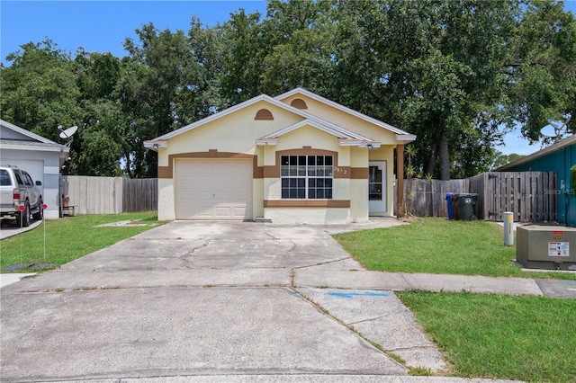 ranch-style home featuring a garage and a front lawn