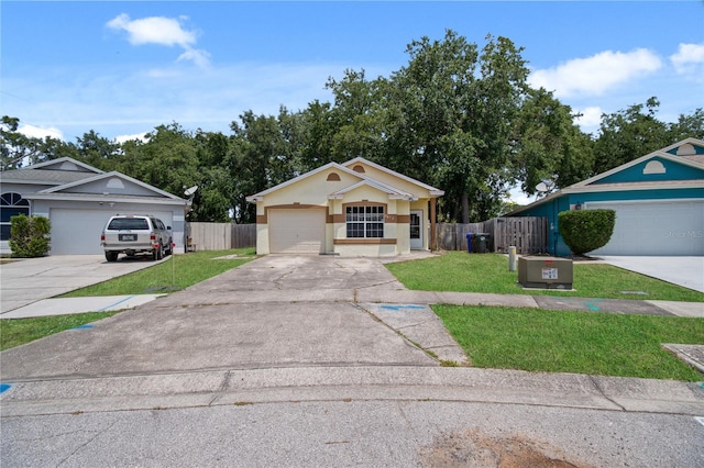 single story home featuring a garage, central AC unit, and a front lawn