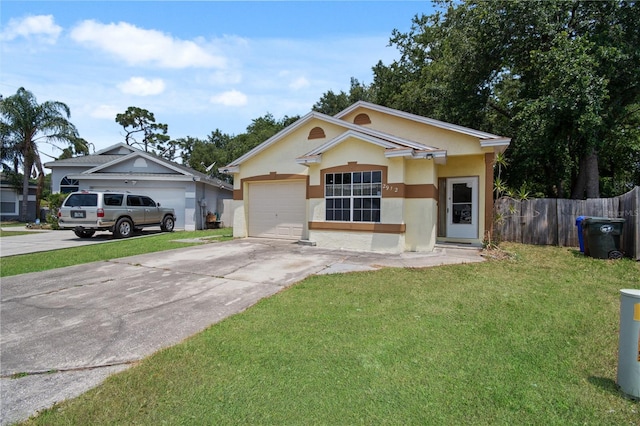 ranch-style house featuring a garage and a front lawn