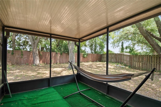 unfurnished sunroom featuring wood ceiling