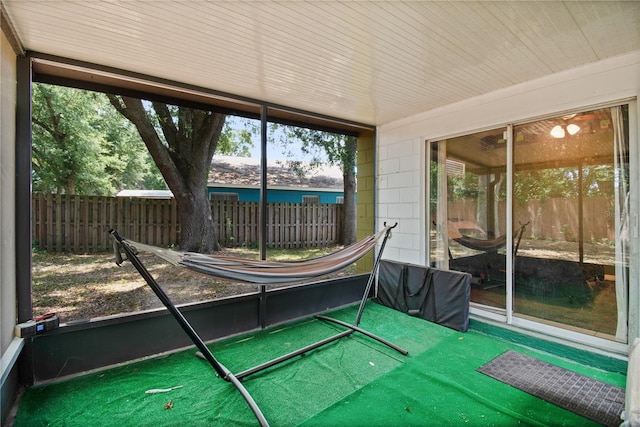 unfurnished sunroom with a wealth of natural light