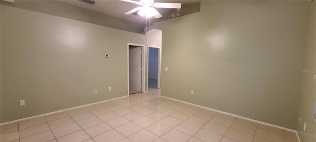 tiled empty room with ceiling fan