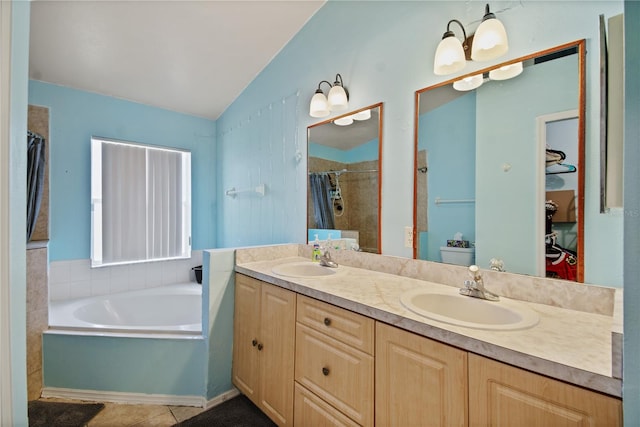 bathroom featuring vanity, vaulted ceiling, tile patterned floors, a chandelier, and independent shower and bath