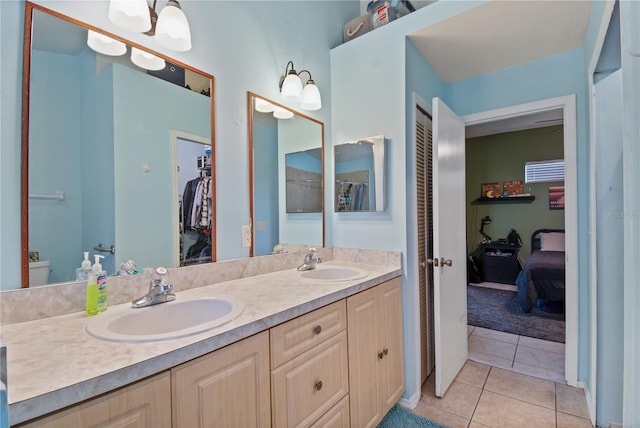 bathroom with tile patterned floors, toilet, and vanity