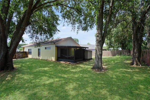 view of yard with a sunroom