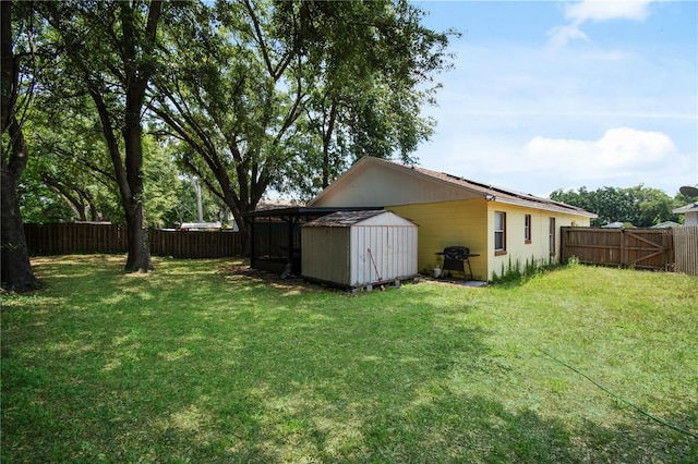 view of yard with a storage unit