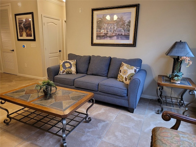 living room featuring crown molding and tile flooring