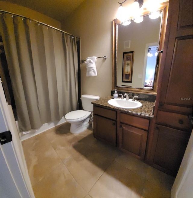 bathroom with oversized vanity, toilet, and tile floors