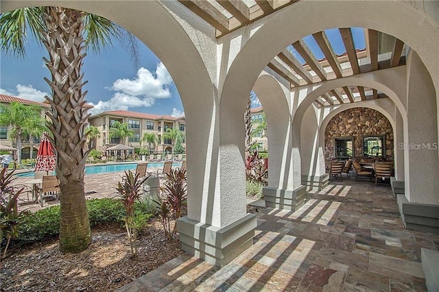 view of terrace featuring a community pool