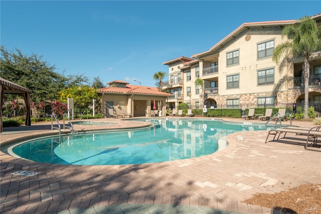 view of swimming pool featuring a patio