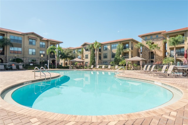 view of swimming pool with a gazebo and a patio