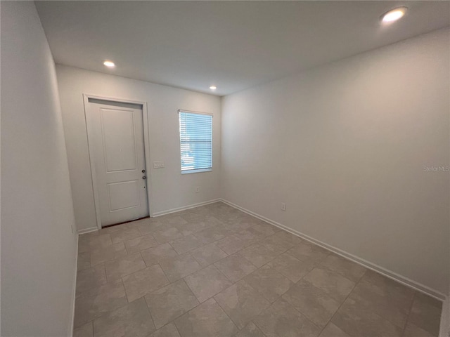 view of tiled spare room