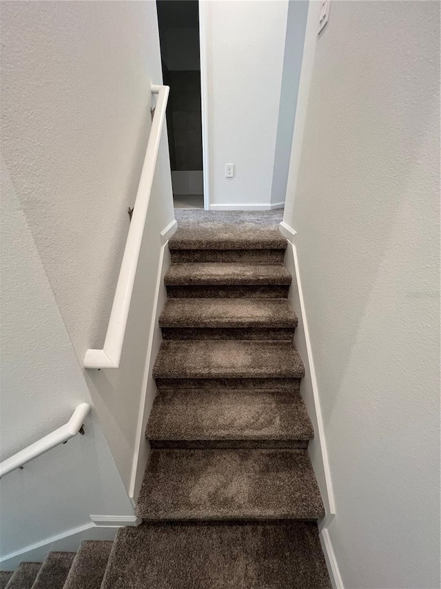 stairway with carpet floors