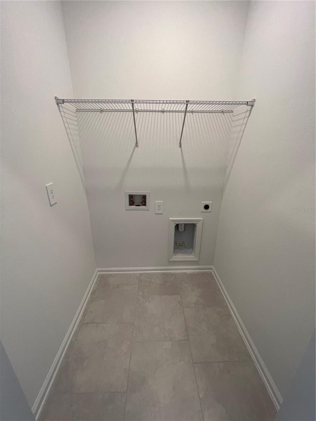 laundry area with tile floors, washer hookup, and electric dryer hookup